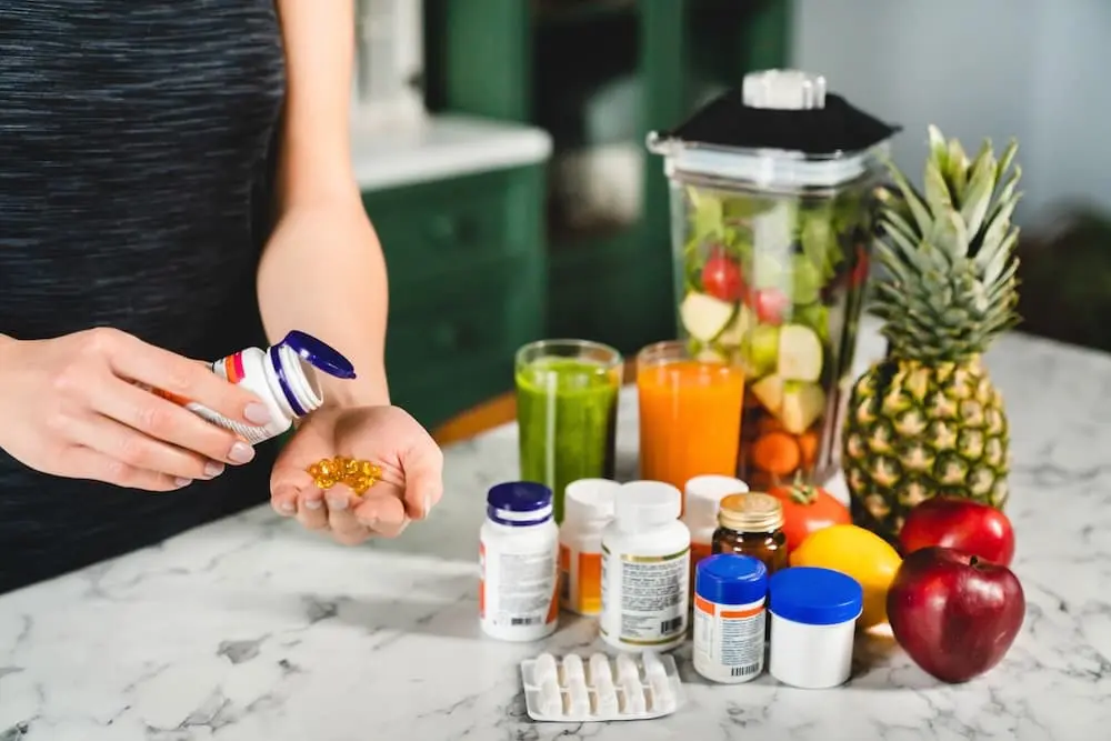 woman taking food supplements instead of fresh fru 2023 11 27 05 32 29 utc